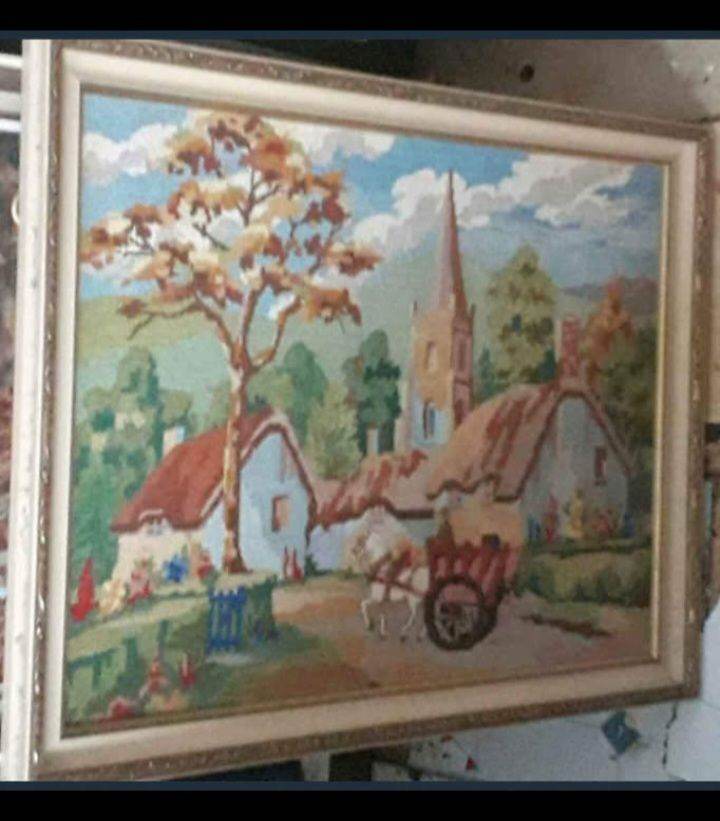 tapestry picture  of a cottage and church 