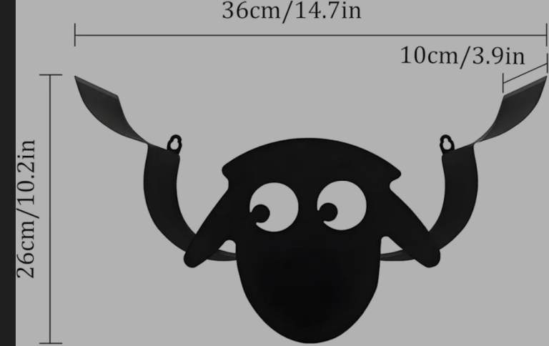 A new still boxed black metal sheep shaped wall mounted toilet roll holder .