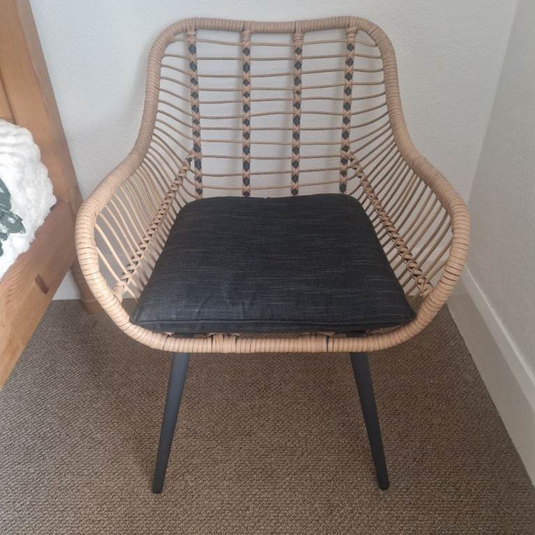 Rattan Style Chair with Black Cushion – Good Condition