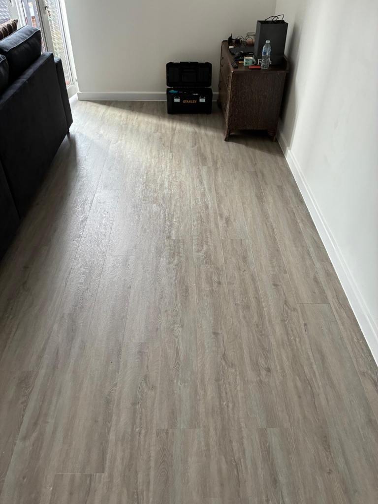 1 box of grey Lvt flooring 