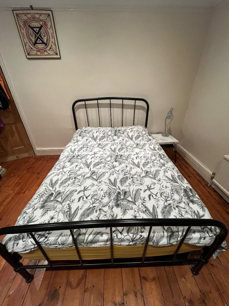 Double bed with mattress and topper