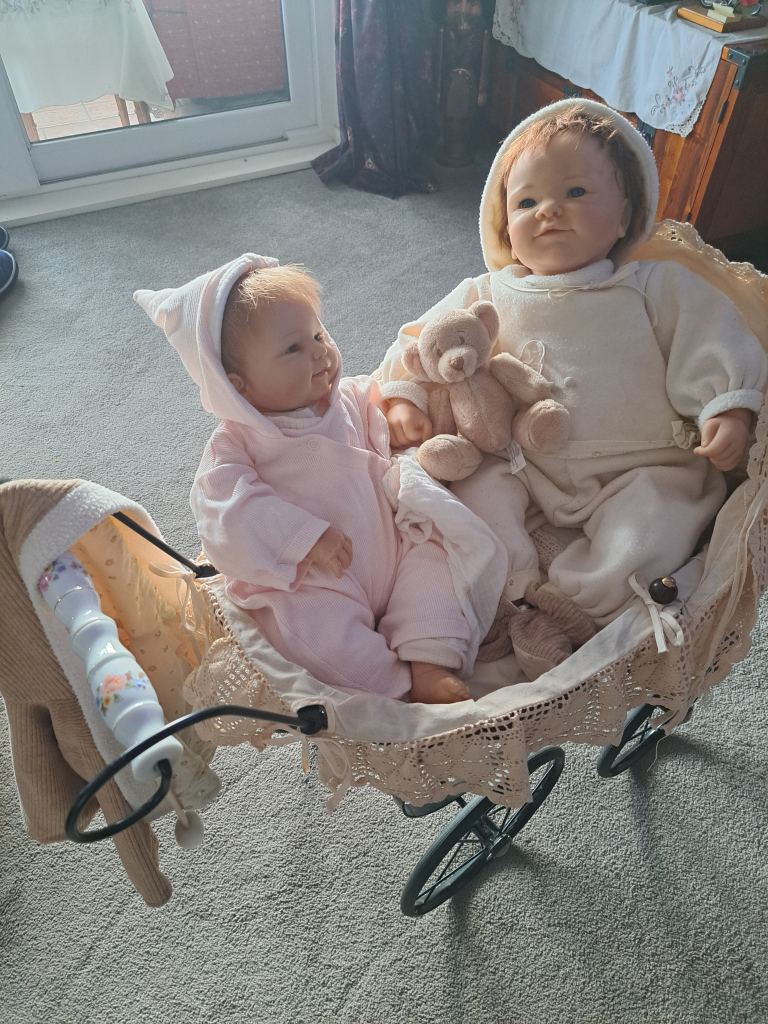 Collectable baby dolls and antique style pram