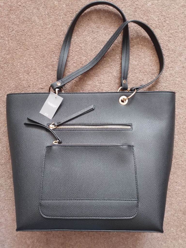 SHOPPING BAG. BLACK FAUX LEATHER. NEW, STILL TAGGED.