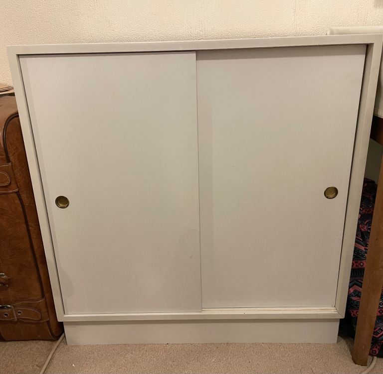 Shelved white wood cupboard