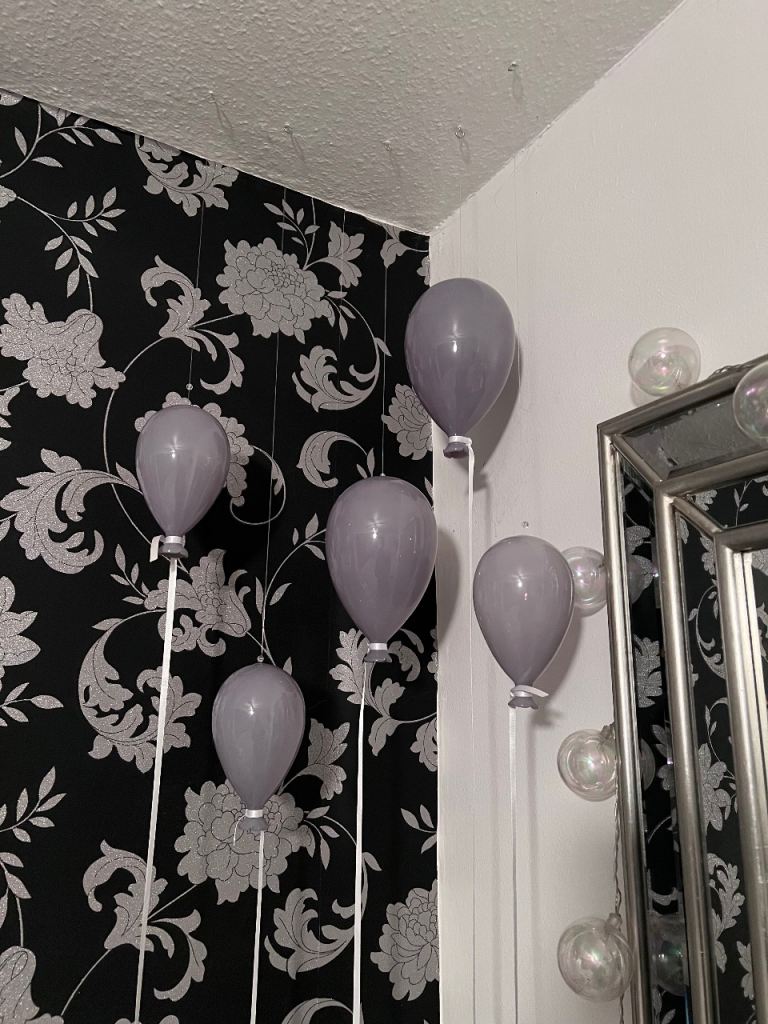 Grey glass balloons hanging