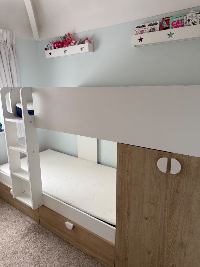Bunk beds with wardrobe and drawer storage. Mattresses included 