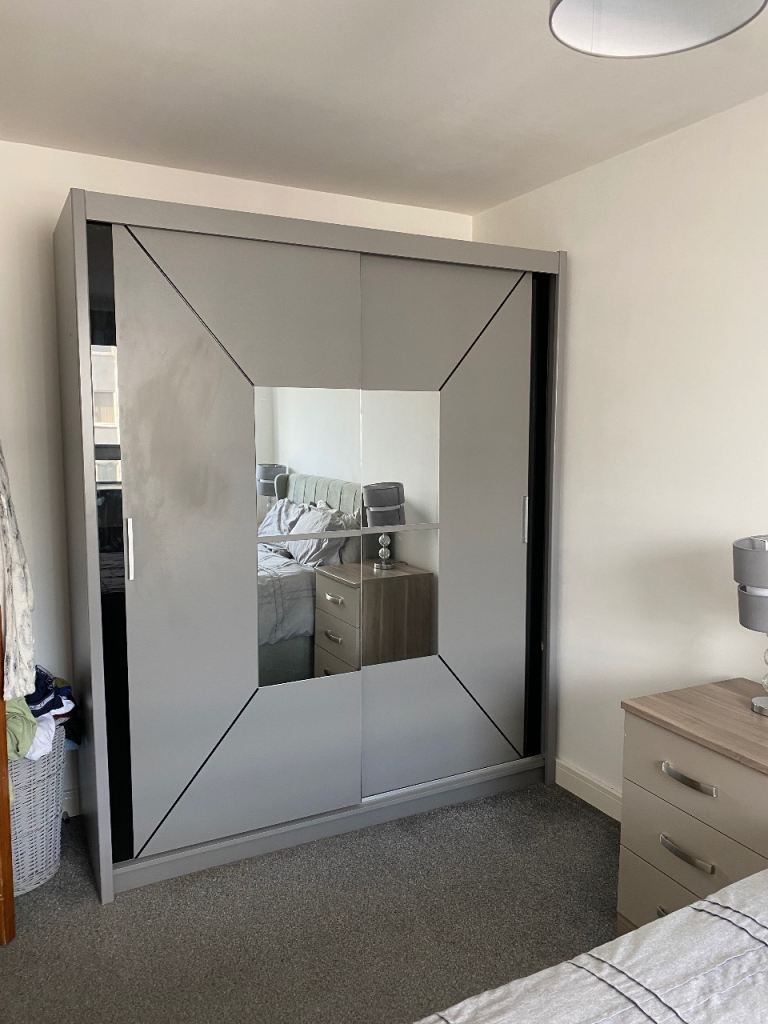 Grey double wardrobe with mirrors/sliding doors