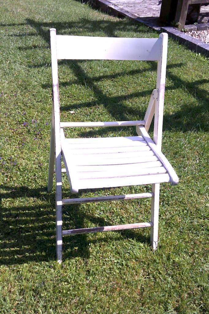 FULL OF CHARACTER, AN ART DECO ERA FOLDING CHAIR 