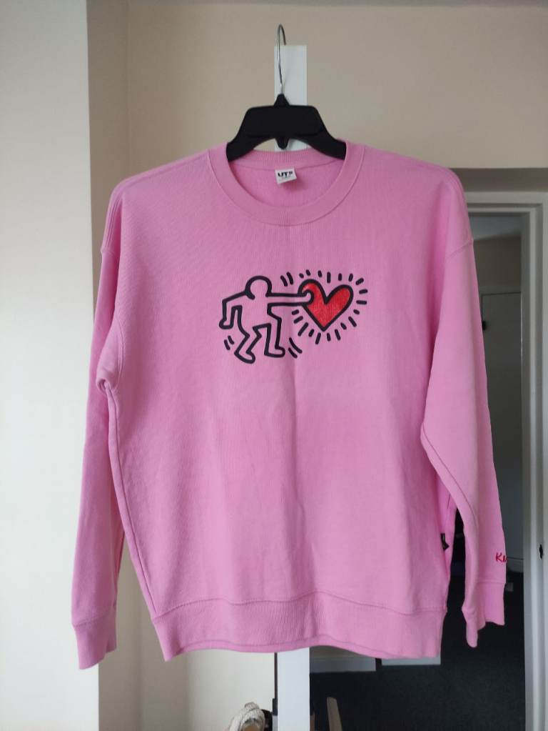 A brand new Uniqlo/ Keith Haring pink sweatshirt, size M 