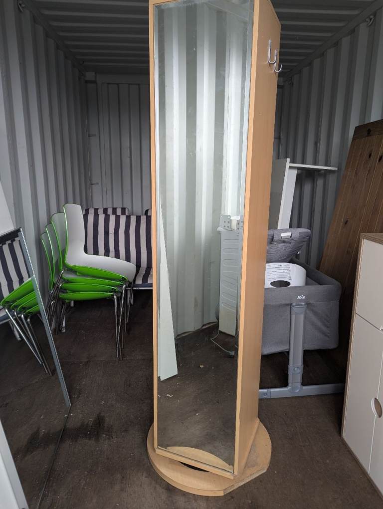 Rotating shelving with mirror on the back