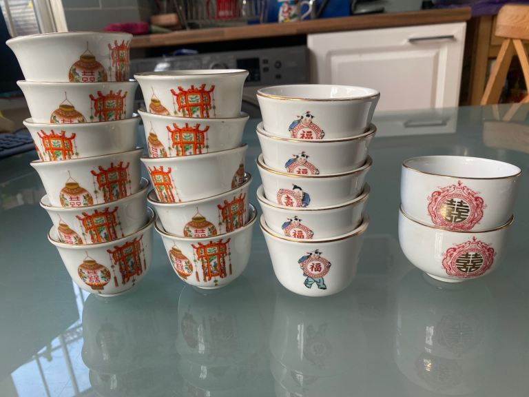 Set of 18 Small White Ceramic Tea Cups with Chinese Motifs