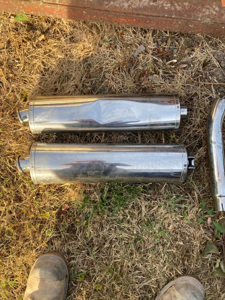 Pair of triumph motorcycle tailpipes 