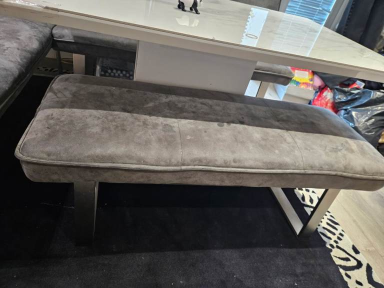 Table with corner chair, sofa and bench