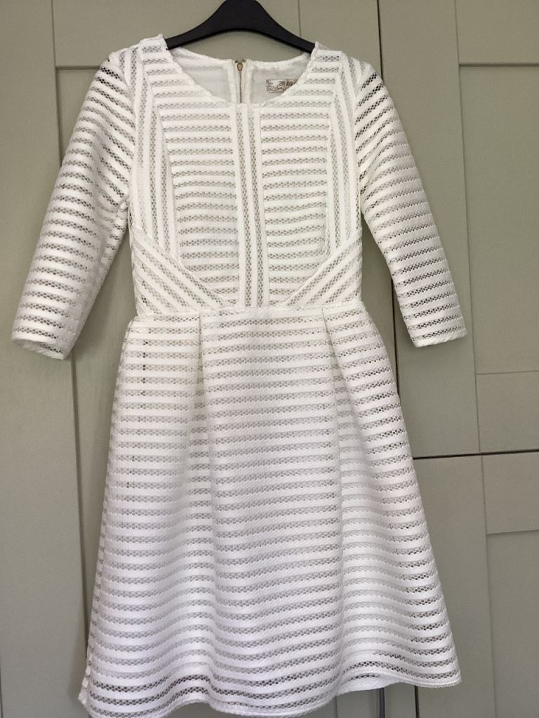 White long sleeved lace dress