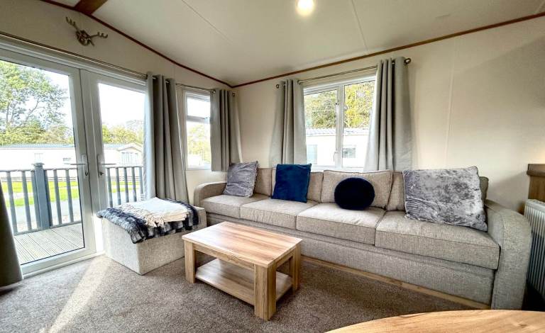 Own a caravan, repaying monthly, near Gt Yarmouth and Lowestoft