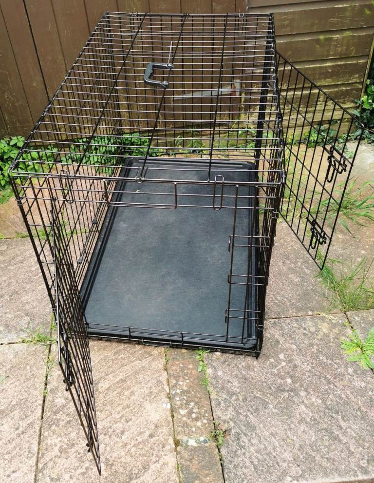 LARGE BLACK STEEL DOG CAGE FOR SALE (Approximate dimensions L. 36  W. 24 H. 25 inches)