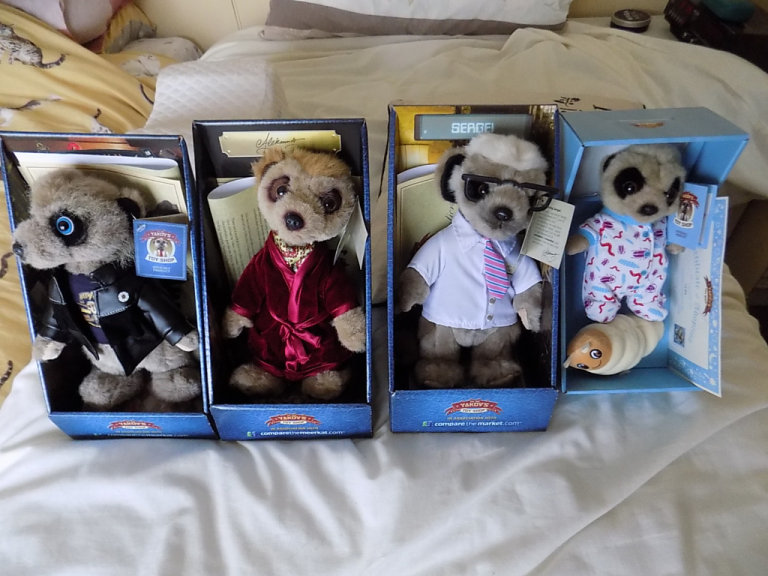 Four Compare the Meerkat Soft Toys