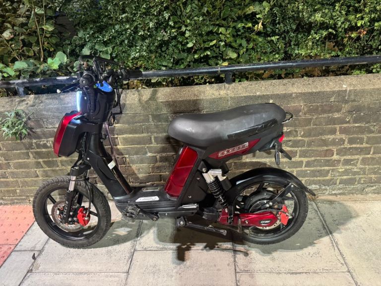 Electric Scooter - Black with Red Accents, Good Condition