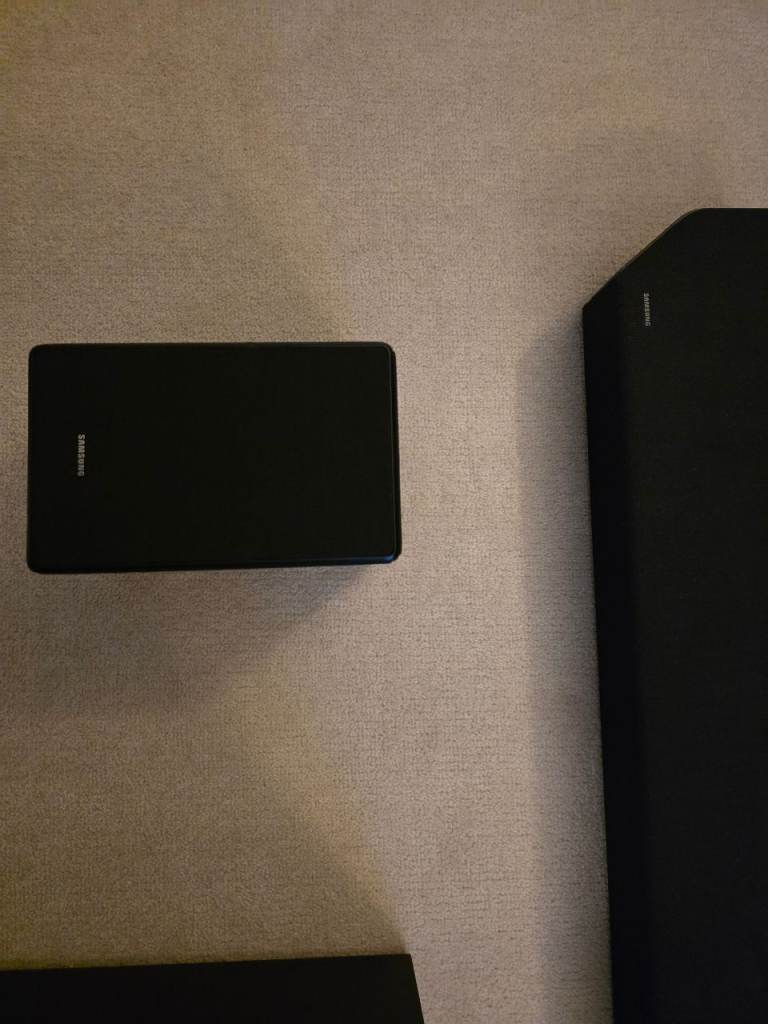 Samsung HW-Q950A soundbar with rear speakers and subwoofer