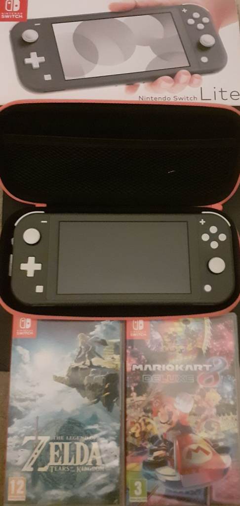 Nintendo Switch Lite in Box with 2 games and carrier. 