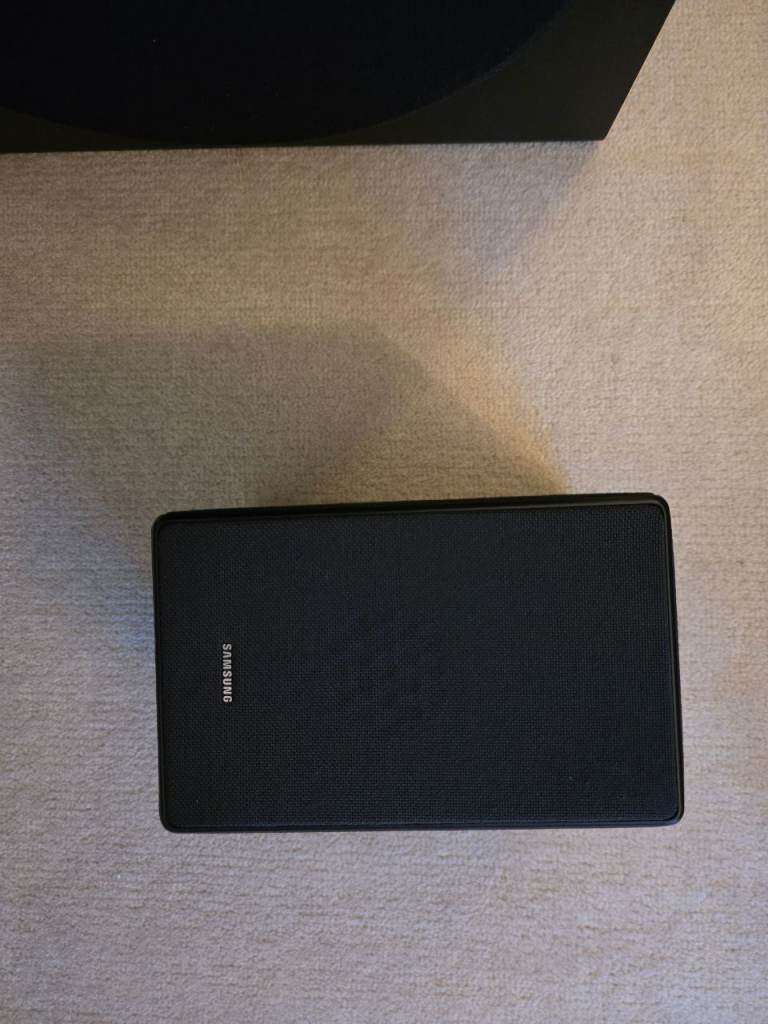 Samsung HW-Q950A soundbar with rear speakers and subwoofer
