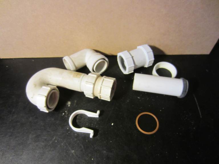 Selection of White Plastic Plumbing Waste Pipes and Fittings