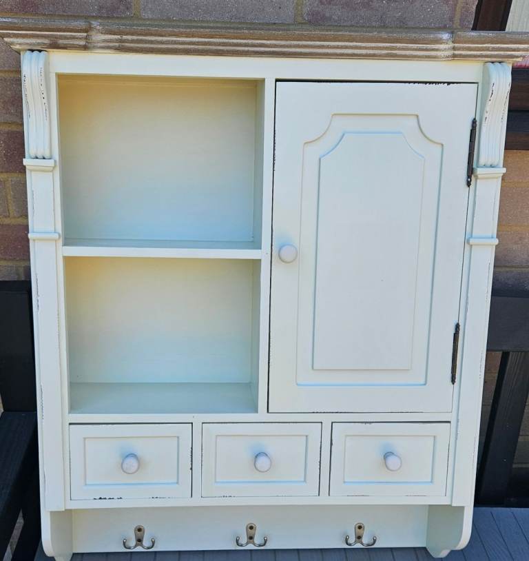 Cream Wall Unit with Shelves, Drawers, and Hooks
