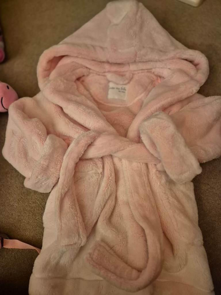 Bundle of toys and dressing gown.