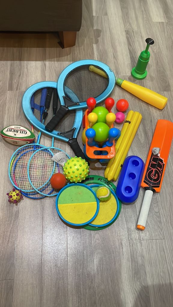 Various garden/bat/racqet/ball toys