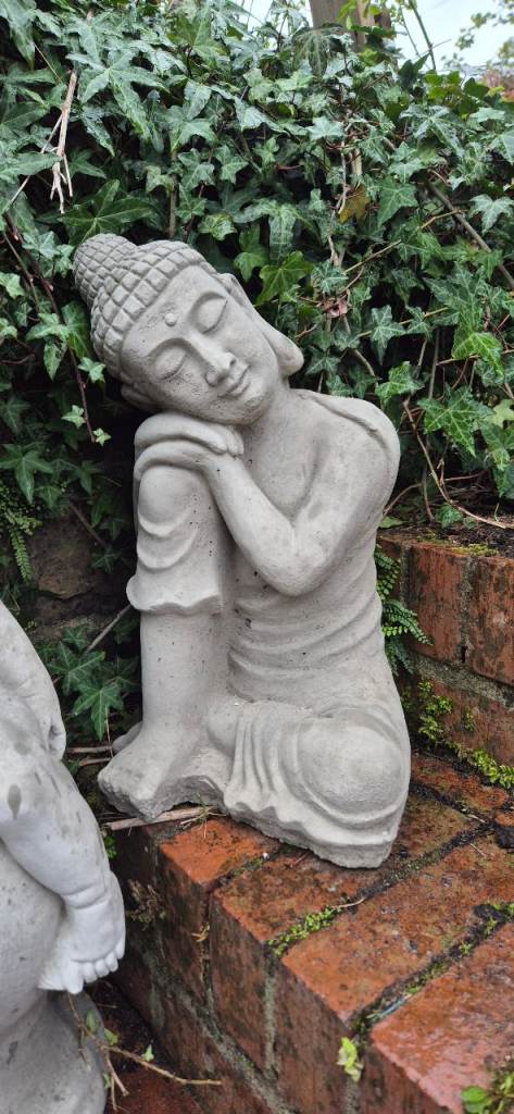 Relaxing concrete garden statue Buddha 