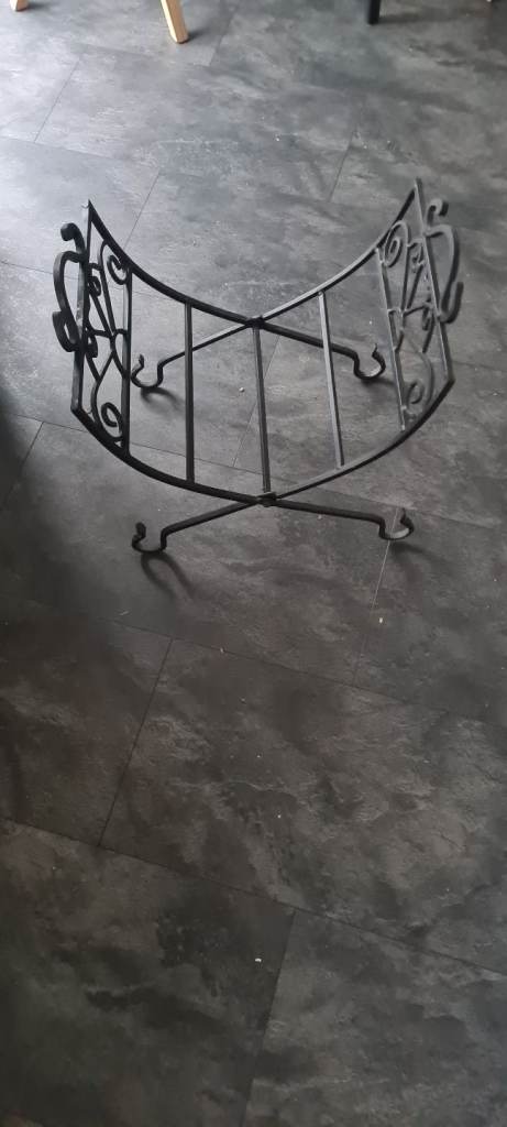 Cast iron folding log storage