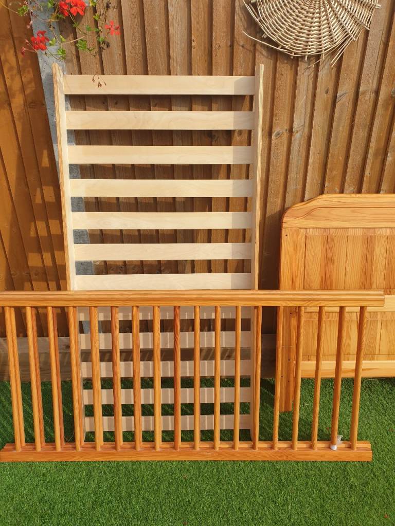 Wooden cotbed with mattress  
