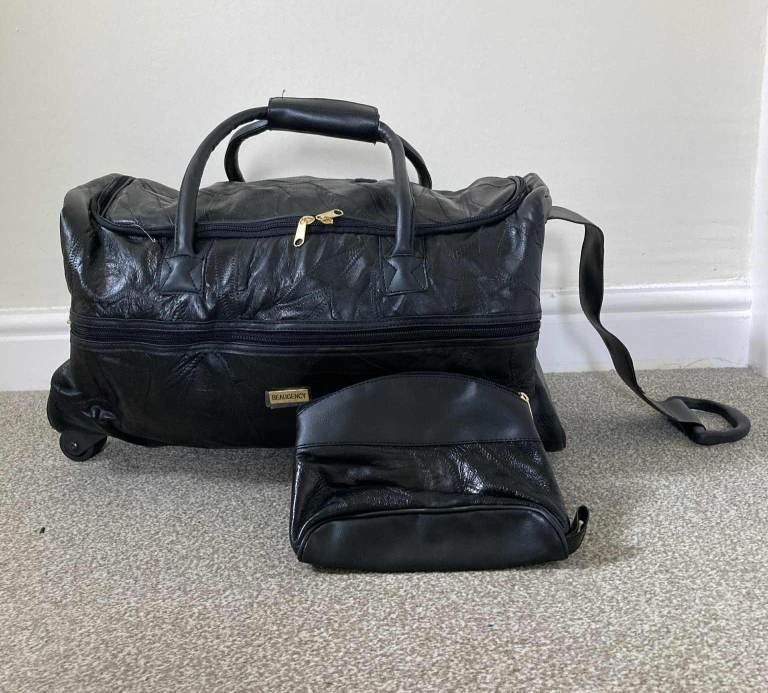 Black 2 wheeled holdall with pull strap + small bag
