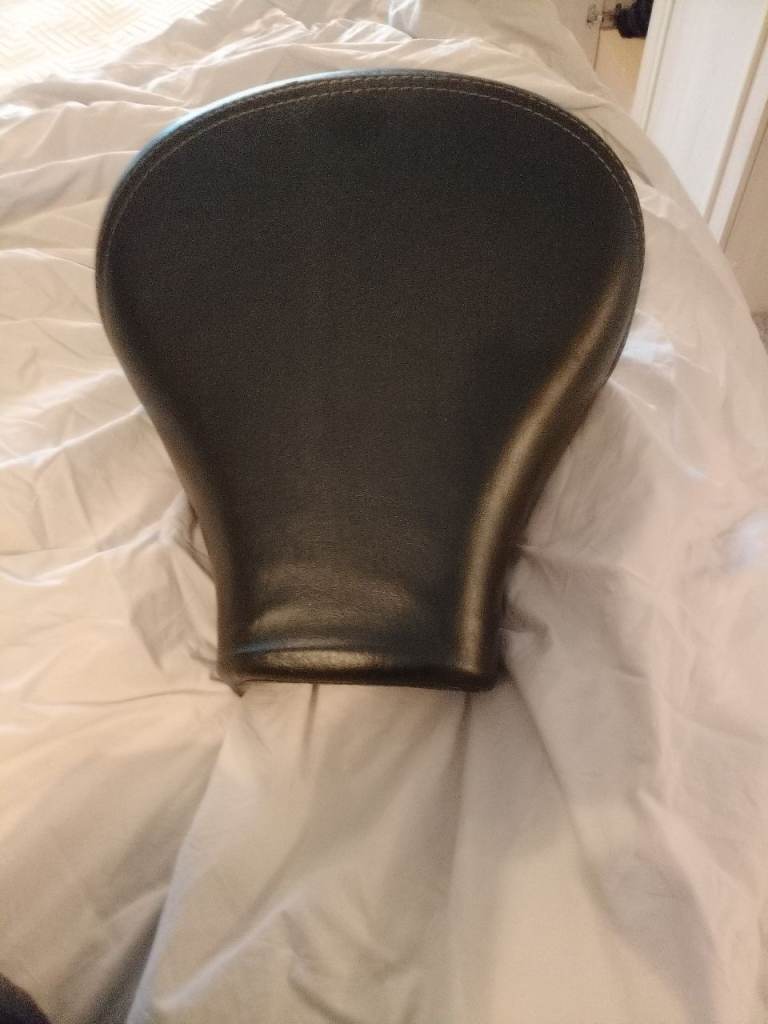 Motorbike rider and pillion seat.