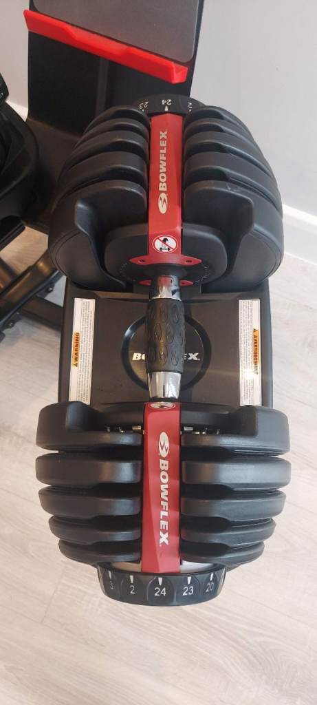 As new Bowflex 552i 2-24kg SelectTech adjustable dumbbells & media stand 