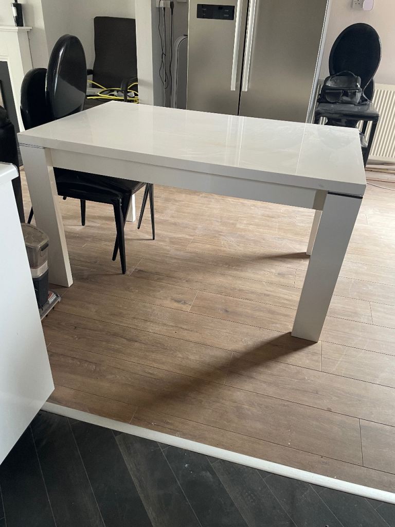 White dining table and black chairs