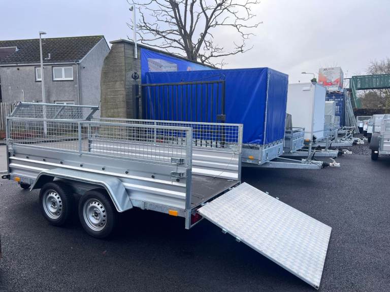 BRAND NEW 10FT X 5FT TWIN AXLE TRAILER WITH 40CM MESH AND RAMP 750KG UN BRAKED