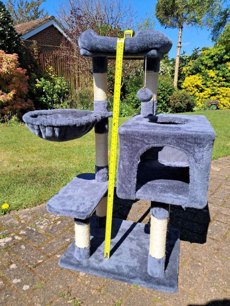 Cat tree including beds, toy, scratching posts