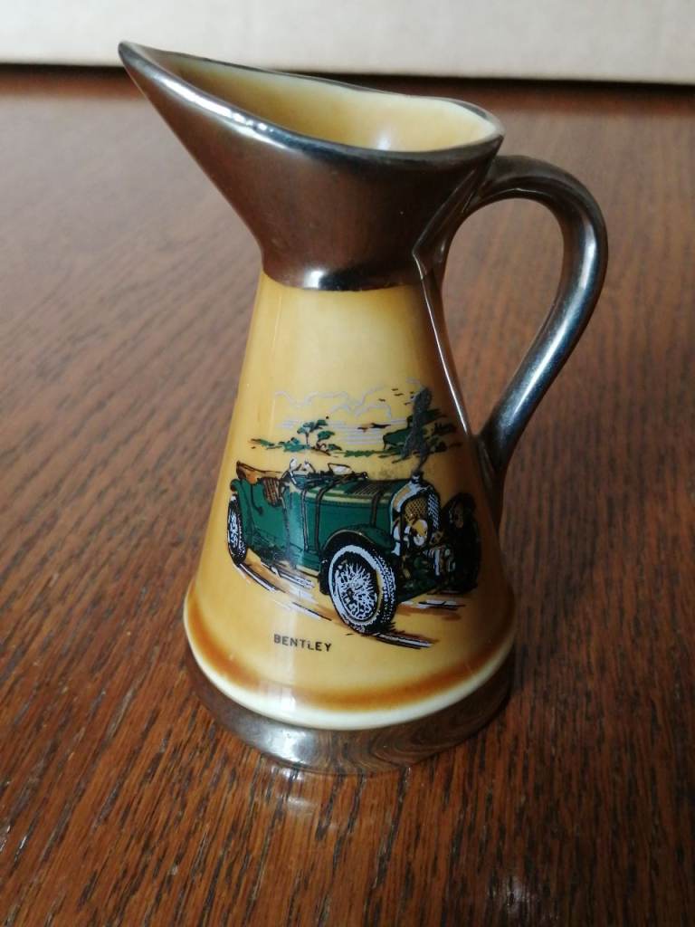 Vintage small jug ornaments for the living room featuring pictures of two cars