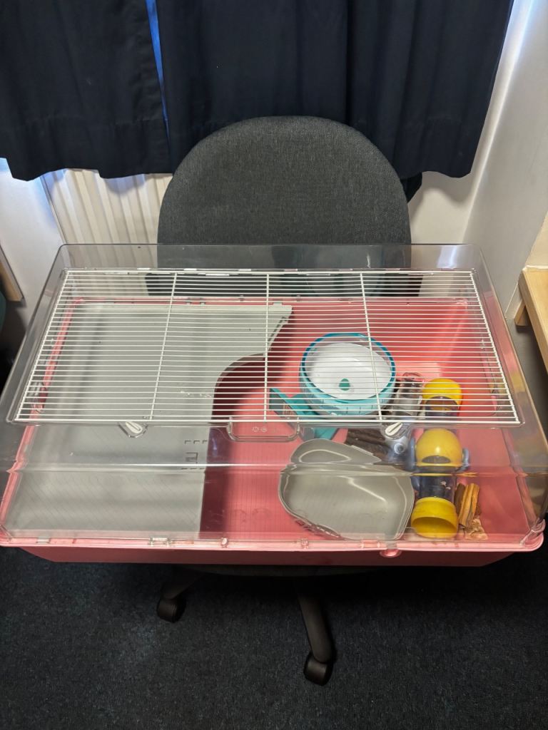 Perfect condition hamster cage with multiple accessories.