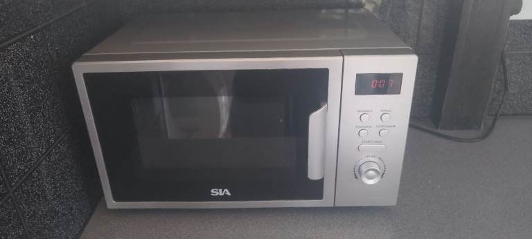 SIA Microwave Oven – Good Condition, Silver