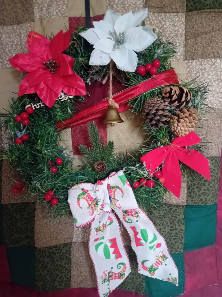 Festive Christmas Wreath with Poinsettias and Bell