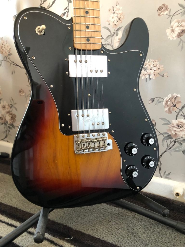 Fender japan deluxe telecaster with tremolo.