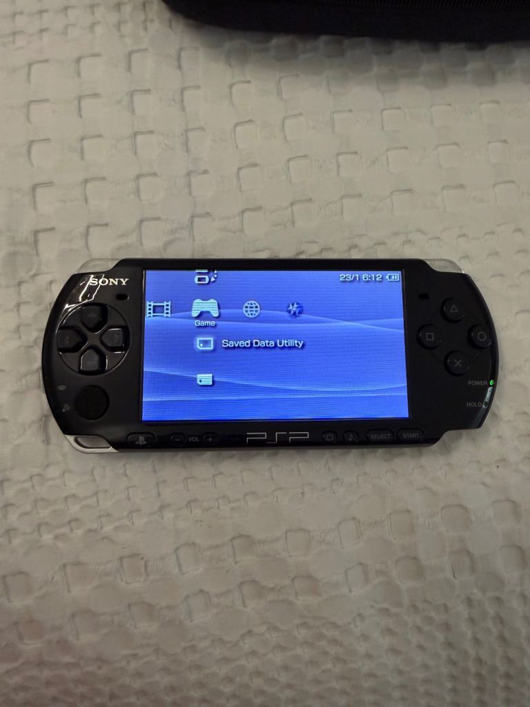 Sony PSP Handheld Console with Games and Case – Good Condition