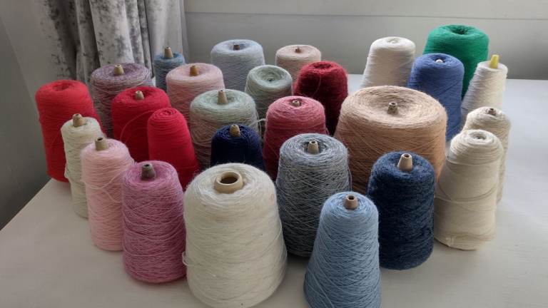 Cones of yarn for knitting, crochet, textile art