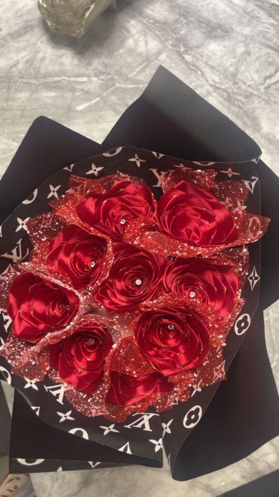 image for Red roses with diamonds on it wrapped in paper