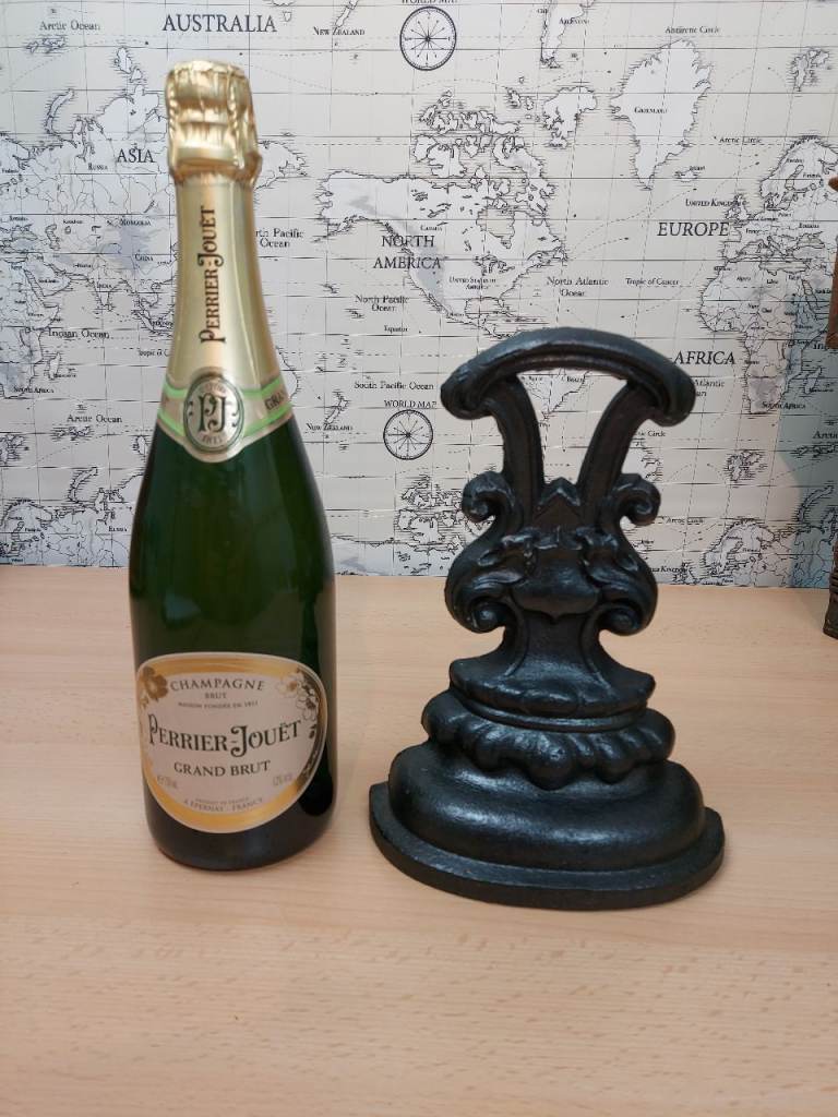 Heavy antique cast iron doorstop or door porter