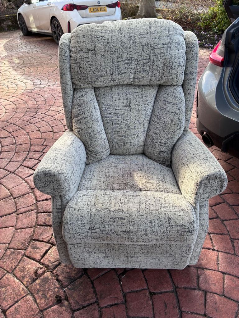 Reclining and “help to stand” electric mobility chair.