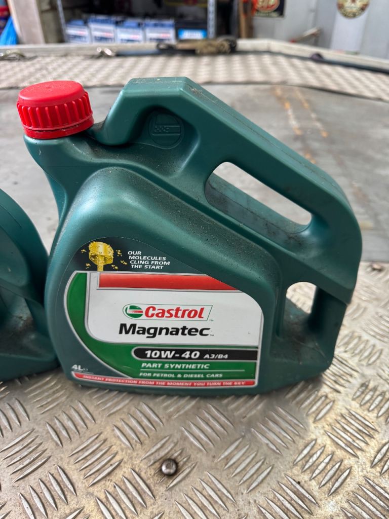 Castrol magnatec oil 1 full sealed 1 half full