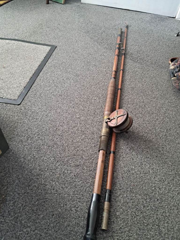 Antique wooden and brass fishing rod and wooden and brass reel